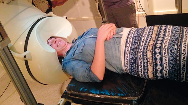 Yael Eisenberg is inside the MEG machine in Dr. Teichers lab.