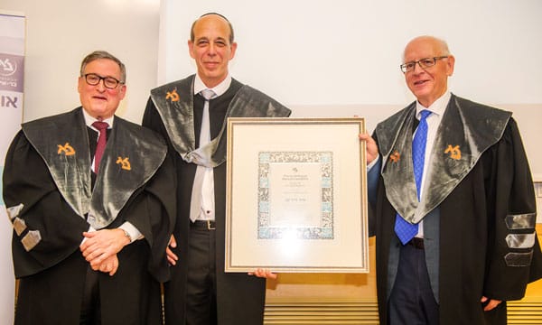 Arie Zaban receives a scroll at the ceremony