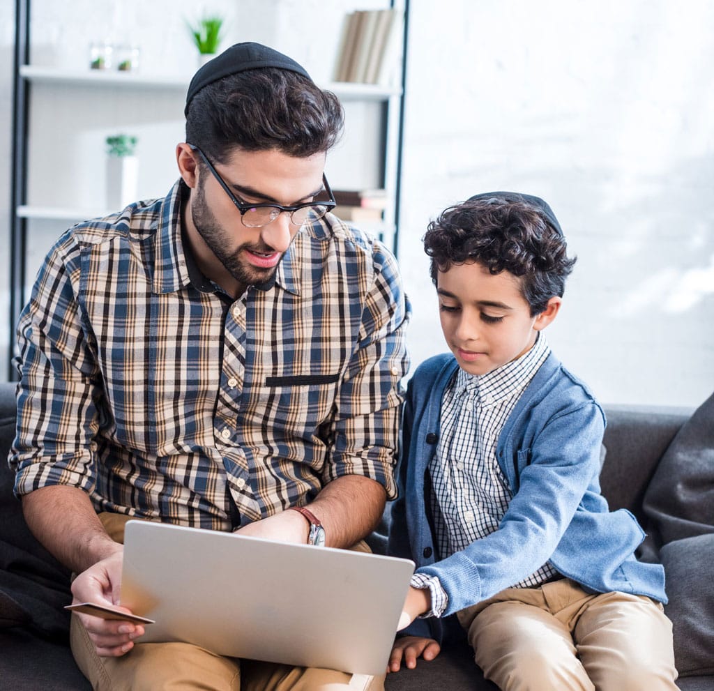 A student assisted with virtual learning by his father